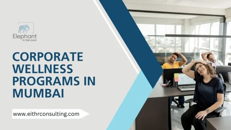 Employees practicing desk stretches as part of corporate wellness programs in Mumbai