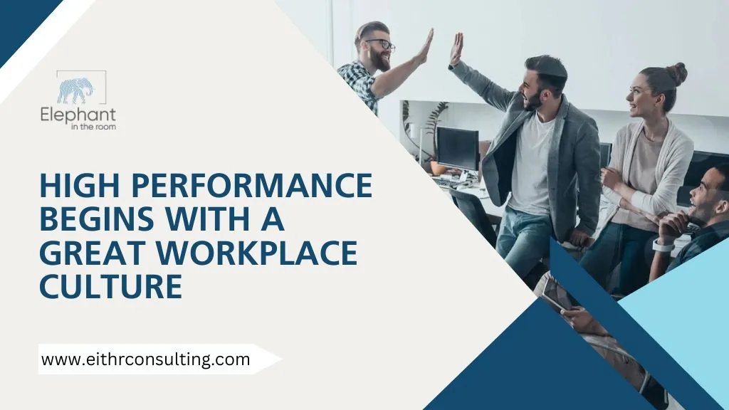 Colleagues high-fiving in an office setting representing strong workplace culture and high performance.