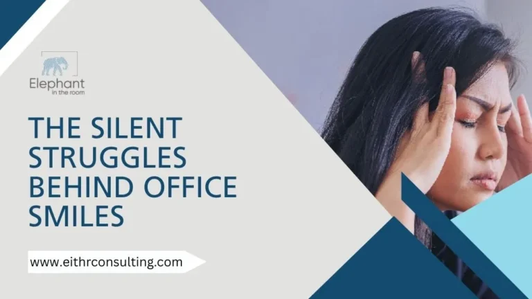 Office employee holding her head showing hidden workplace stress and anxiety