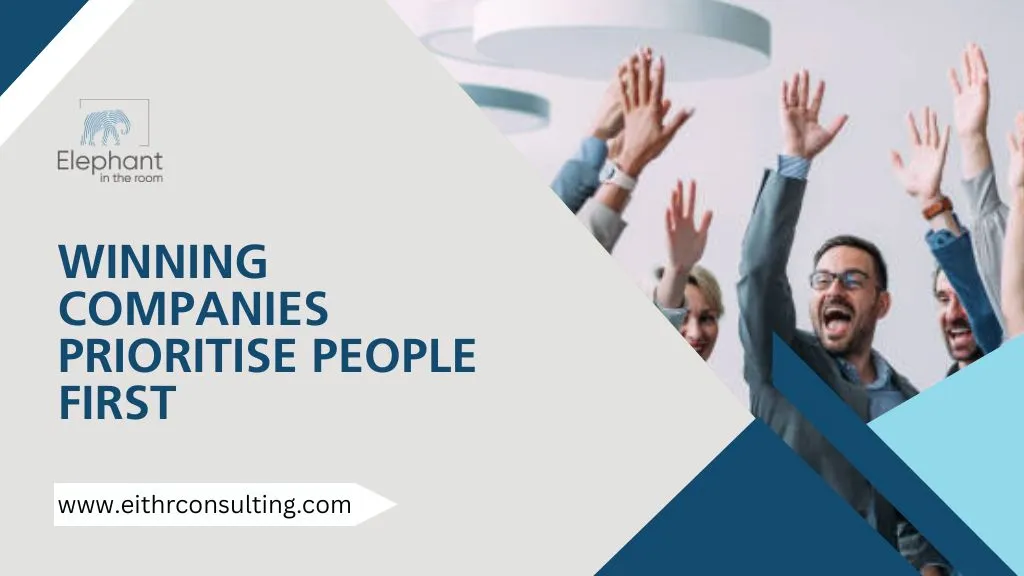 Team celebrating success in the workplace highlighting the importance of people-first company culture.