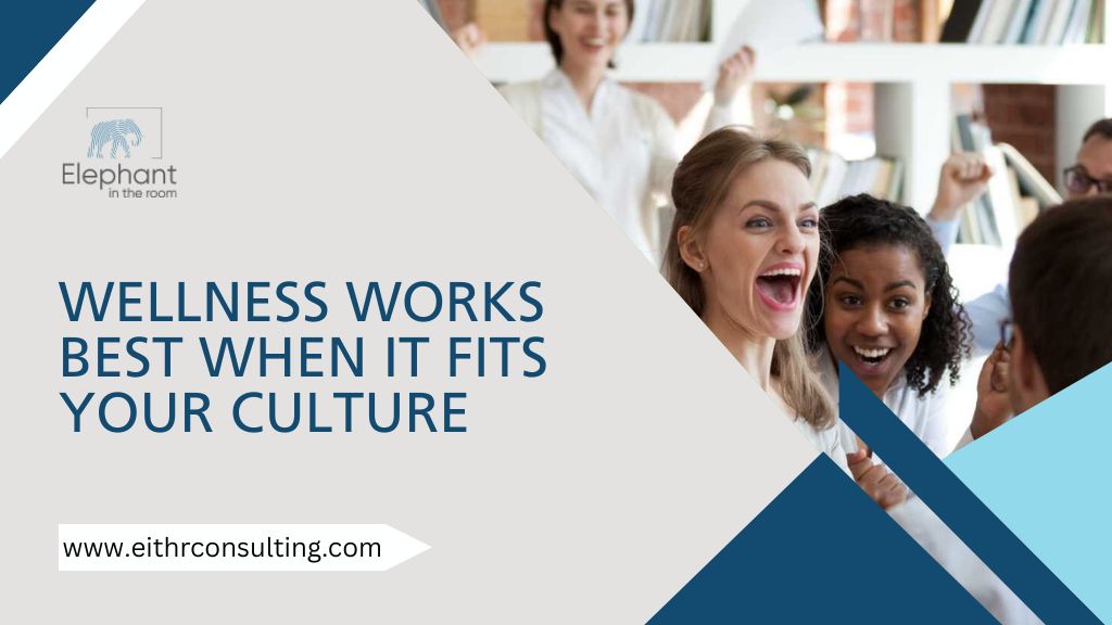 Happy employees celebrating together, showing workplace wellness aligned with company culture