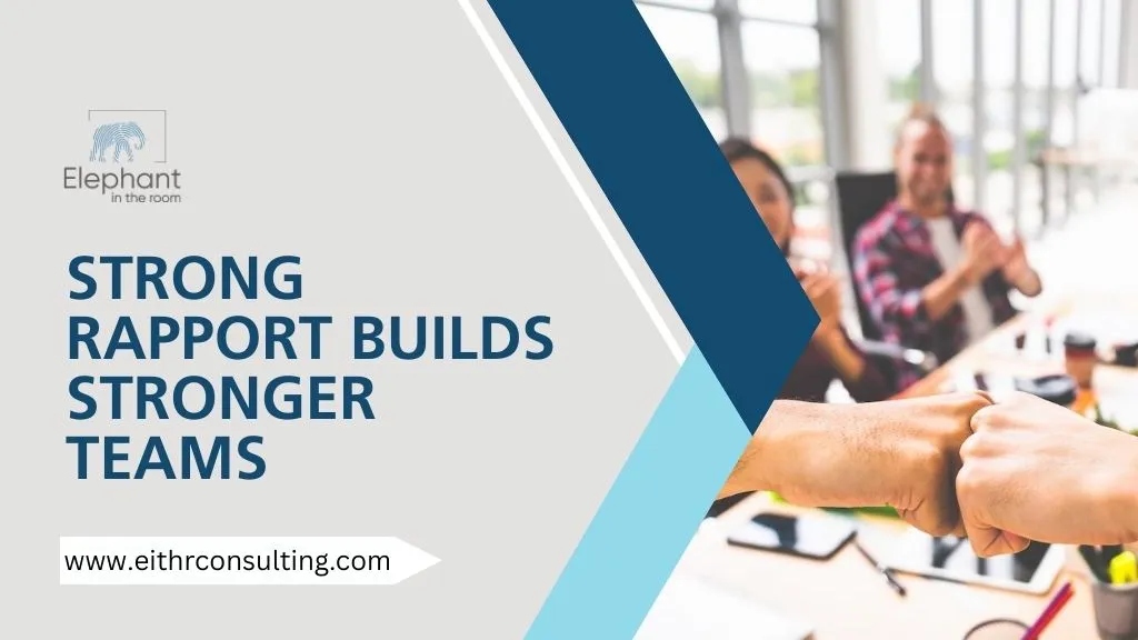 Team members fist-bumping in an office meeting, symbolizing strong rapport, teamwork, collaboration, and positive workplace culture.